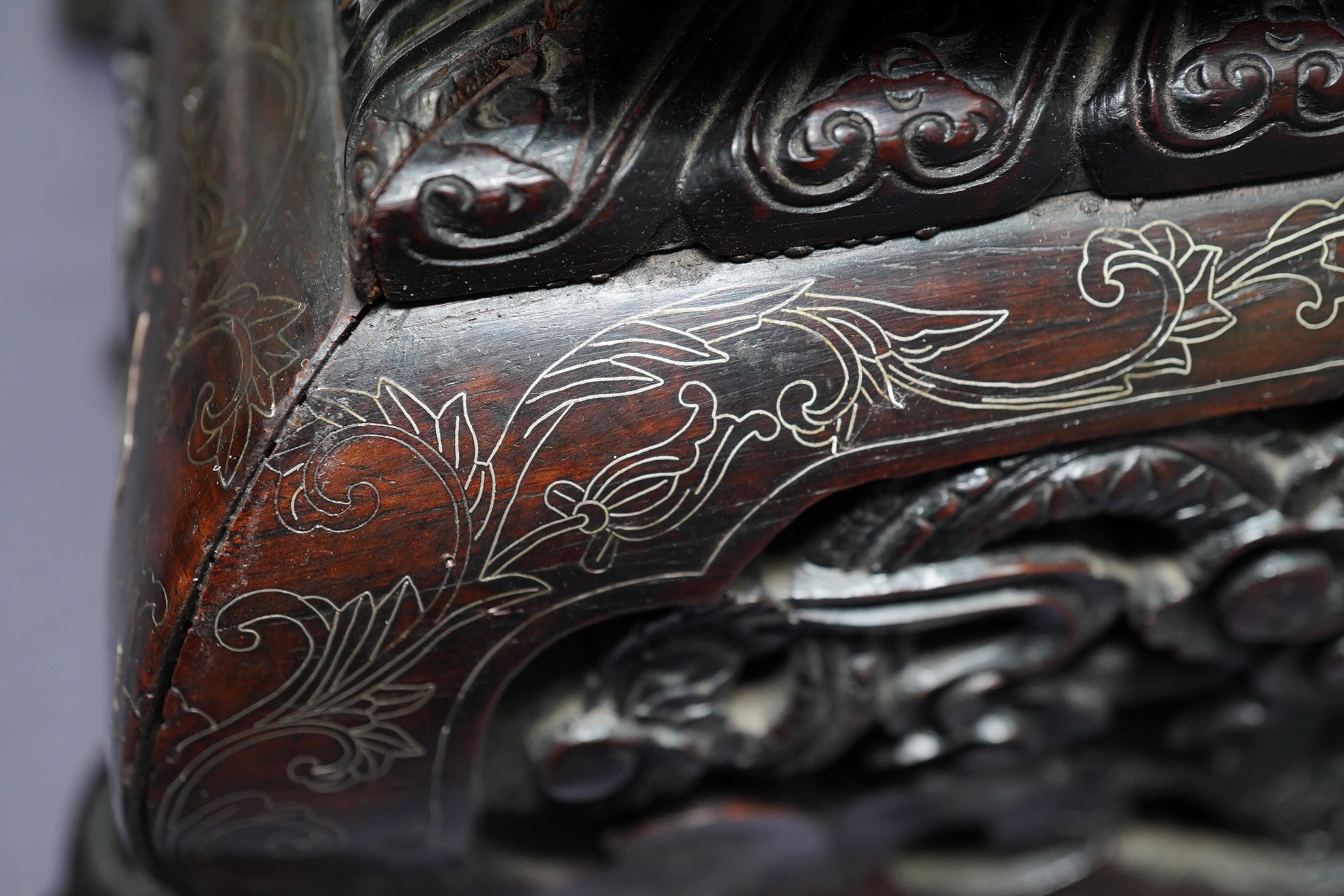 An important pair of Chinese carved zitan and silver wire inlaid ‘cloud and dragon’ curio cabinets and stands, duobaoge, probably Imperial, late Qing dynasty